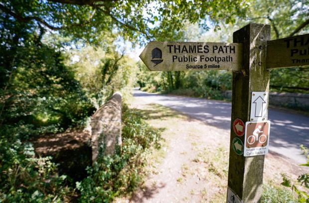 Oxford Mail: A view of a signpost for the Thames Path near to Somerford Keynes. Picture: Andrew Matthews/PA