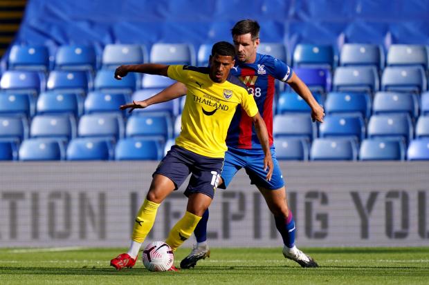 Marcus McGuane and Scott Dann tussle for the ball during a pre-season friendly in 2020. Picture: John Walton/ PA Wire