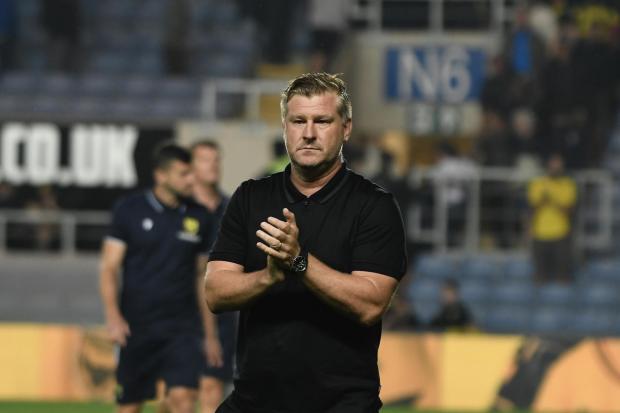 Karl Robinson and his Oxford United players were distraught after the defeat to Lincoln City Pictures: David Fleming
