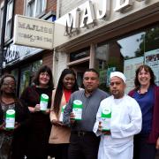 Flora Periera, Lucy Nichol, Fatou Ceesay and Ncky Barnetson (right) with Loylu Miah and Moynul Islam from Majliss, one of the restaurants on the Cowley Road which are supporting Refugee WeekPicture: Ric Mellis11/6/2019