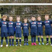 Launton Under 9s with poppies on their shirt before their weekend match