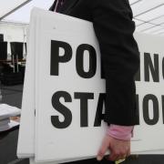 Ballot boxes and polling station signs.
