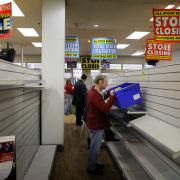 Shoppers clear the shelves as Woolworths in Templars Square, Cowley, closes for the last time in January 2009. Picture: Damian Halliwell