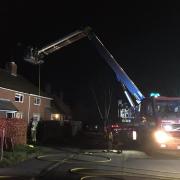 Crews tackle village chimney fire