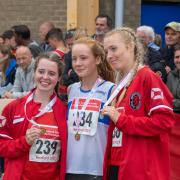 Eloise Hind (centre) achieved a personal best and a season's best in Germany Picture: Ian Marriott