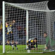 Tom Craddock follows the ball into the net to claim Oxford United’s winner as they come from a goal behind to beat Bradford 2-1 at the Kassam Stadium on Saturday