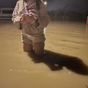Chilton Close resident standing in flood water