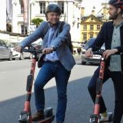 Councillor Andrew Gant on an e-scooter