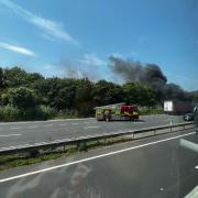 The lorry on fire and the fire service