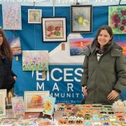 Ukrainian women selling crafts on the community stall at Bicester Friday market