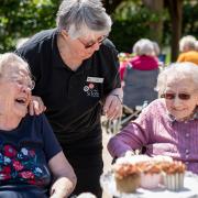 Residents and staff at The Orders of St John Care Trust enjoy time spent together