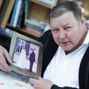 Stephen Holt with a photograph of his wedding to Dawn who took her own life in 2009