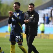 Josh Murphy and Des Buckingham applaud the home support at full-time
