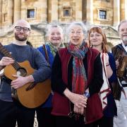 Oxford Folk Festival musicians with organiser Ginnie Redston, centre