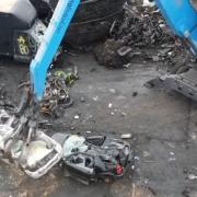 Several seized cars were destroyed.