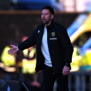 Oxford United head coach Des Buckingham on the touchline during the first leg