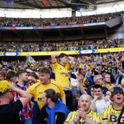Oxford United supporters celebrate their side’s promotion to the Sky Bet Championship