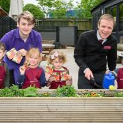 The Old Station Nursery children planting their seeds alongside Stuart Locke (right), Bewley Homes sales manager