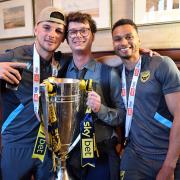 Mark Harris, the Oxford Mail’s sports reporter Liam Rice, and Josh Murphy with the League One play-off final trophy