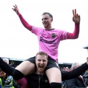 Marc Leonard (on shoulders) celebrates promotion with Northampton Town