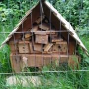 A hedgehog house made of wood by pupils from Sonning Common Primary School