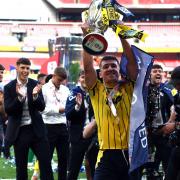 Cameron Brannagan lifts the League One play-off final trophy at Wembley