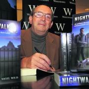 Nigel Wild, president of Oxford Chamber of Commerce, signs copies of his first novel in Waterstone’s, Broad Street