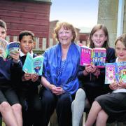 County council cabinet member for education Melinda Tilley with Buckland Primary School pupils, from left, James Coombs, 10, Joseph Langdon, nine, Abby Hallion-Gammon, 10, and Daisy Torrington, 10