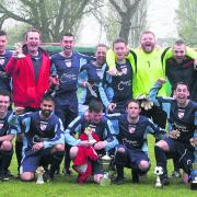 Barton United’s squad show their joy at winning the Hedley Toms/Michael Brown Memorial Trophy