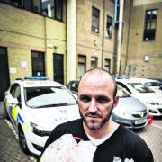 Sgt James Blackmore at St Aldate’s police station with bags of hard drugs seized during Operation Bilbo