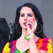 Making a habit of it... Lana Del Rey smoking on stage at Glastonbury earlier this year