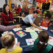 Liberal Democrat leader Nick Clegg MP takes part in a reception class finger-painting session with pupils and Layla Moran, the  prospective parliamentary candidate for Oxford West and Abingdon
