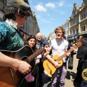 Outcry: Buskers in Cornmarket Street protest at the proposed ‘Public Spaces Protection Orders’ which would impact on the activities of buskers