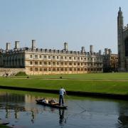 Picture perfect: Punting on the Cam past the famous Kings College Chapel and Clare College, but how does Cambridge measure up against Oxford as a place to live?
