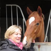 Eve Johnson Houghton with youngster Super Julius, who she predicts will be “a superstar”