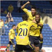 Phil Trainer celebrates his second goal with Danny Roase and Alex Jeannin
