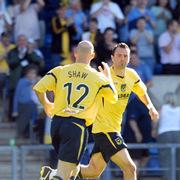 Jeannin celebrates his goal with Paul Shaw