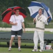 Kingston Bagpuize captain Dave Pearce (left) and his Oxford 2nd counterpart Ross Buchanan watch the rain fall before their match was called off