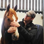 Grand National hopeful Drop Out Joe with trainer Charlie Longsdon at his Hull Farm Stables near Chipping Norton. Picture: Jon Lewis