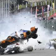 LUCKY ESCAPE: The Renault of Nico Hulkenberg (right) sends Fernando Alonso over the Sauber of Charles Leclerc in yesterday’s Belgian Grand Prix Picture: Geert Vanden Wijngaert/AP