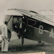 The Prince of Wales jumps down from a D.H. Rapide on Port Meadow in July 1933