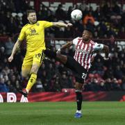 Jamie Mackie challenges for the ball at Brentford  Picture: David Fleming
