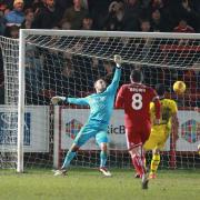 Luke Armstrong (left) seals Oxford United's defeat in stoppage-time at Accrington Stanley  Picture: Richard Parkes