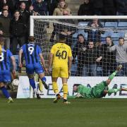 Simon Eastwood keeps out a penalty from Gillingham top scorer Tom Eaves  Picture: David Fleming