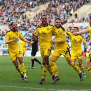 Curtis Nelson (No 5) is congratulated after putting Oxford United ahead at Coventry City  Picture: James Williamson