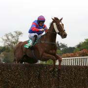 Step Back and Jamie Moore on their way to winning the bet 365 Gold Cup at Sandown
Picture: Julian Herbert/PA