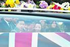 A family member reaches out to the coffin of Lance Corporal Gajbahadur Gurung from the Royal Gurkha Rifles