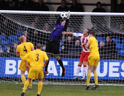 Oxford City keeper Matt Ingram claims a corner against Brackley