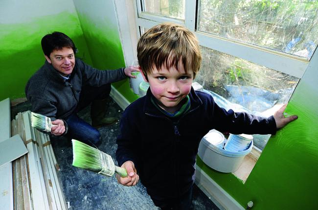 Tim Nicholson gets some help redecorating the house from son Benjamin, six