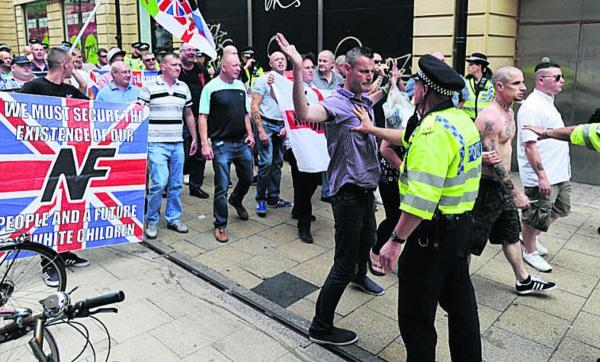 National Front members square up to the police